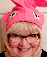 Missy Day wearing a pink fish hat